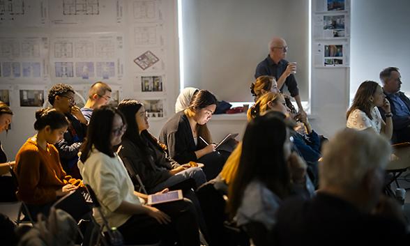 People sitting at an event.