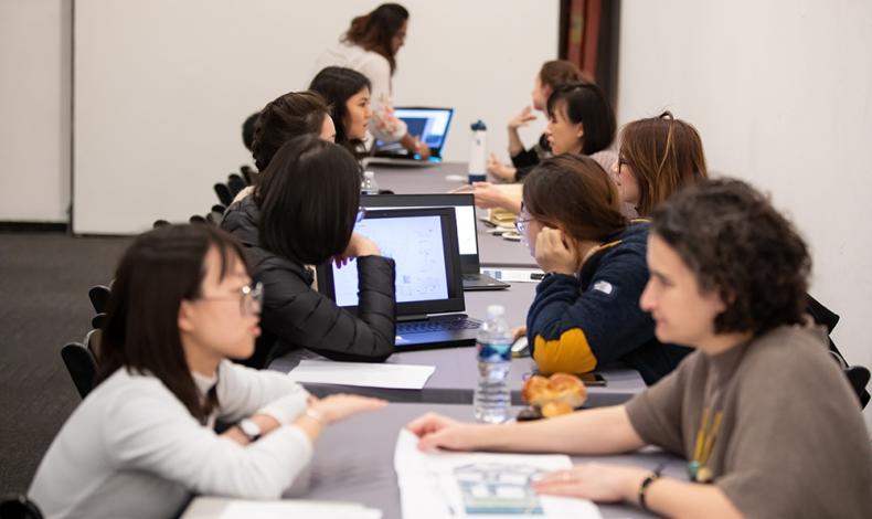 Students talking over computers